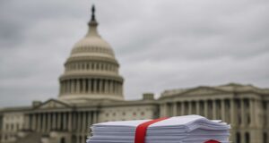 Crypto Week in Limbo: GOP Infighting Stalls U.S. Crypto Bills — For Now A stack of legislative documents bound with red tape sits on a stone ledge in front of the blurred US Capitol building under overcast skies, symbolizing stalled US crypto regulation and Congressional gridlock.