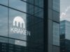 Kraken Joins Corporate Push Behind Trump Accounts — But With a Wyoming Twist Glass facade of a modern office tower reflecting the Kraken logo, with blurred financial charts and ticker tape in the background, symbolizing crypto IPO ambitions and institutional finance.